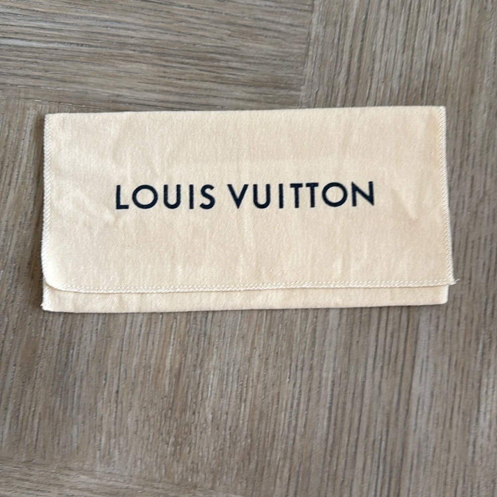 Louis Vuitton Cream Canvas Clutch
